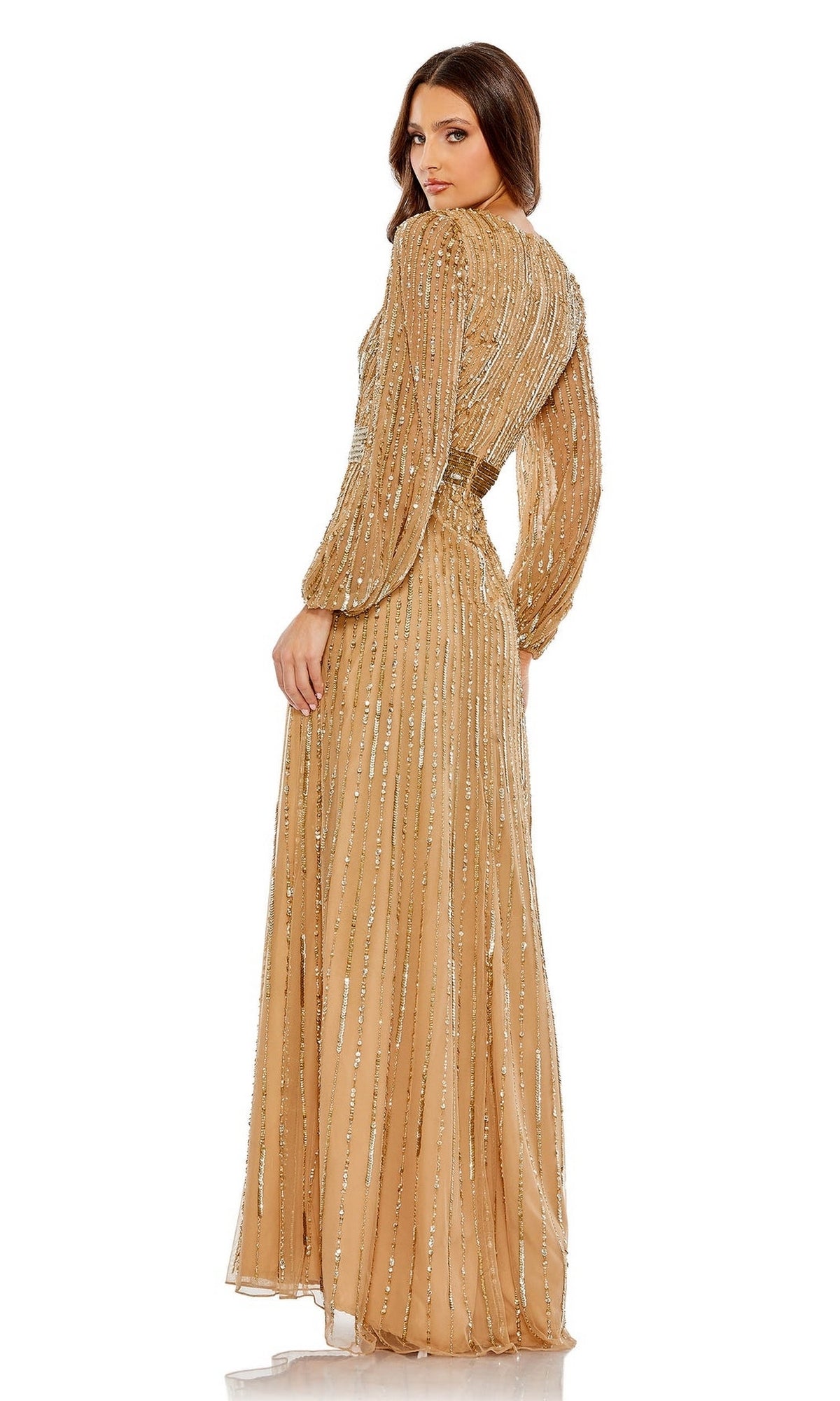 A woman faces away, wearing the Long Formal Dress 5718 by Mac Duggal—a gold, sequined, floor-length gown with long sleeves and a fitted waist—while looking over her shoulder.